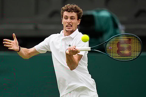 Ugo Humbert plays a forehand return to Carlos Alcaraz